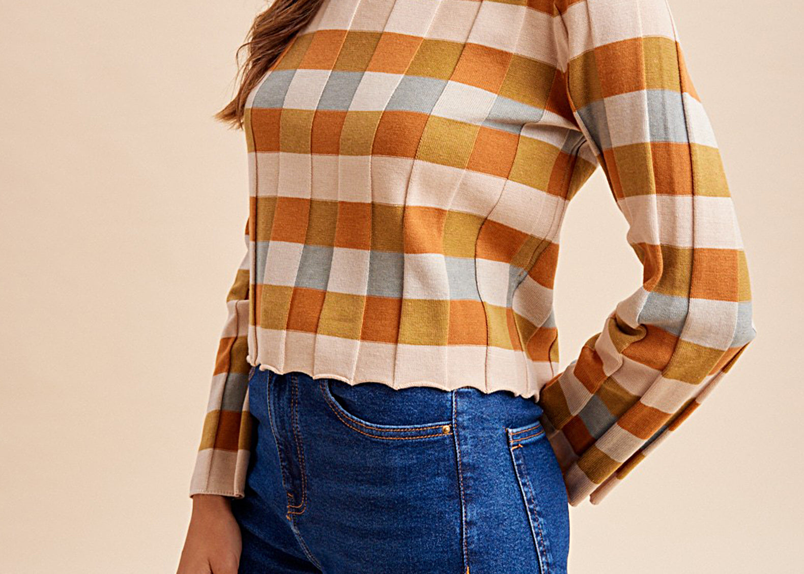 Orange and mustard checkered knit top, side view
