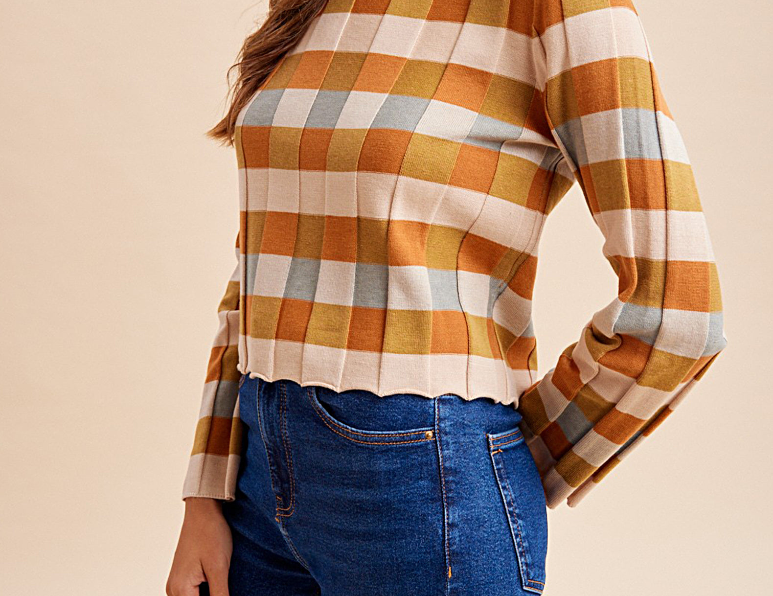 Orange and mustard checkered knit top, side view