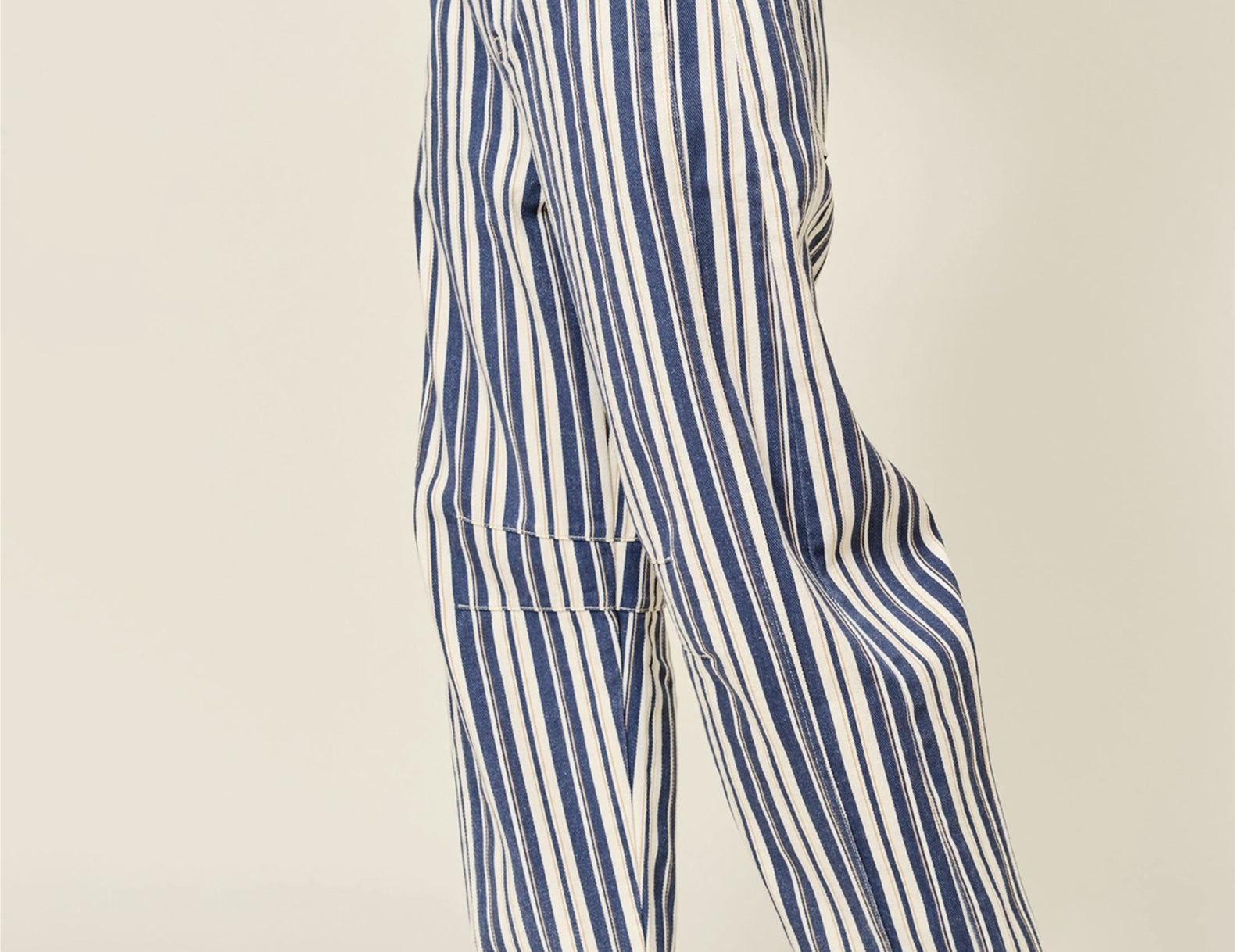 Striped cotton barrel pants, side profile view