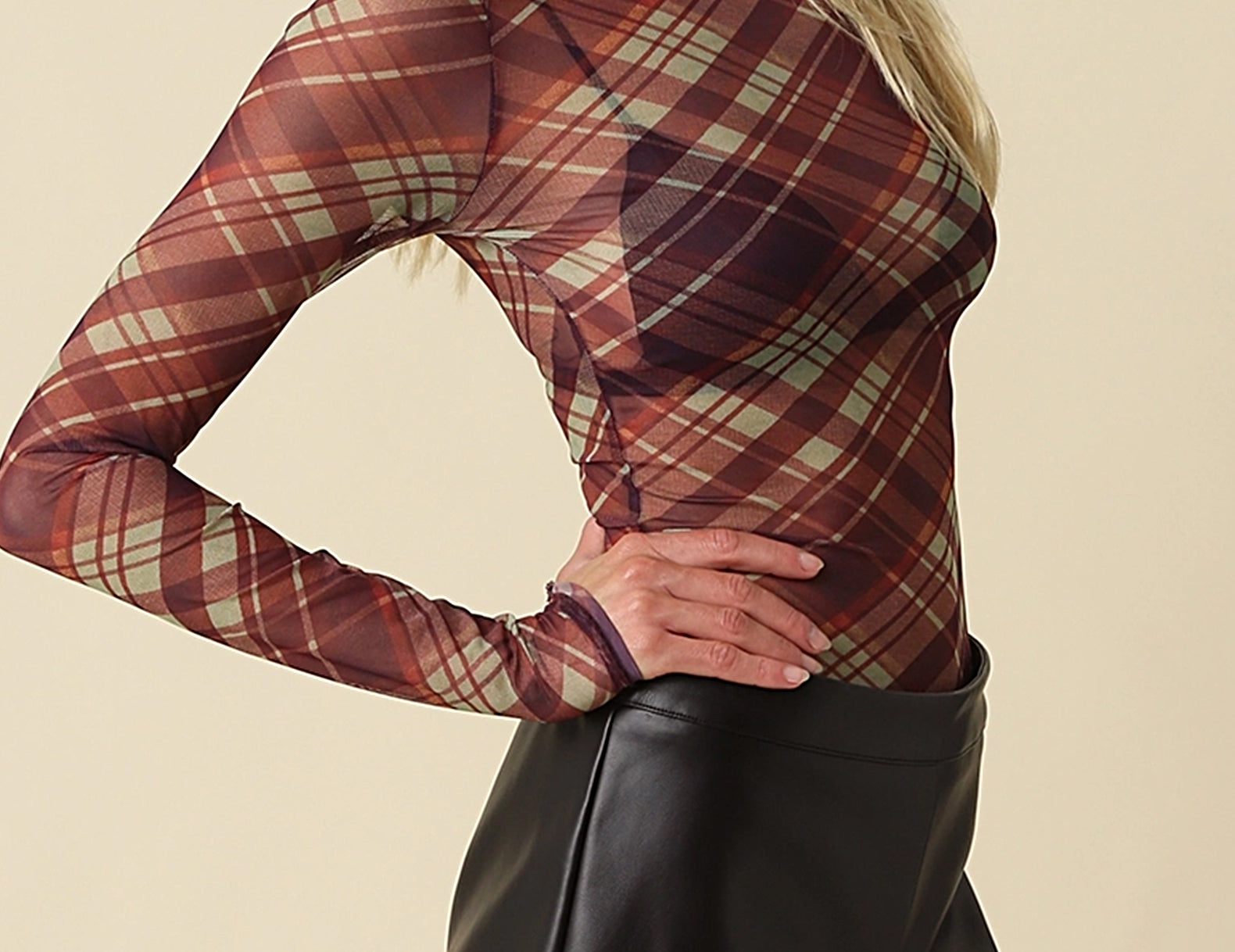 Side profile of the Jackie Plaid Mesh Mock Neck Top showing the mock neck and second-skin fit