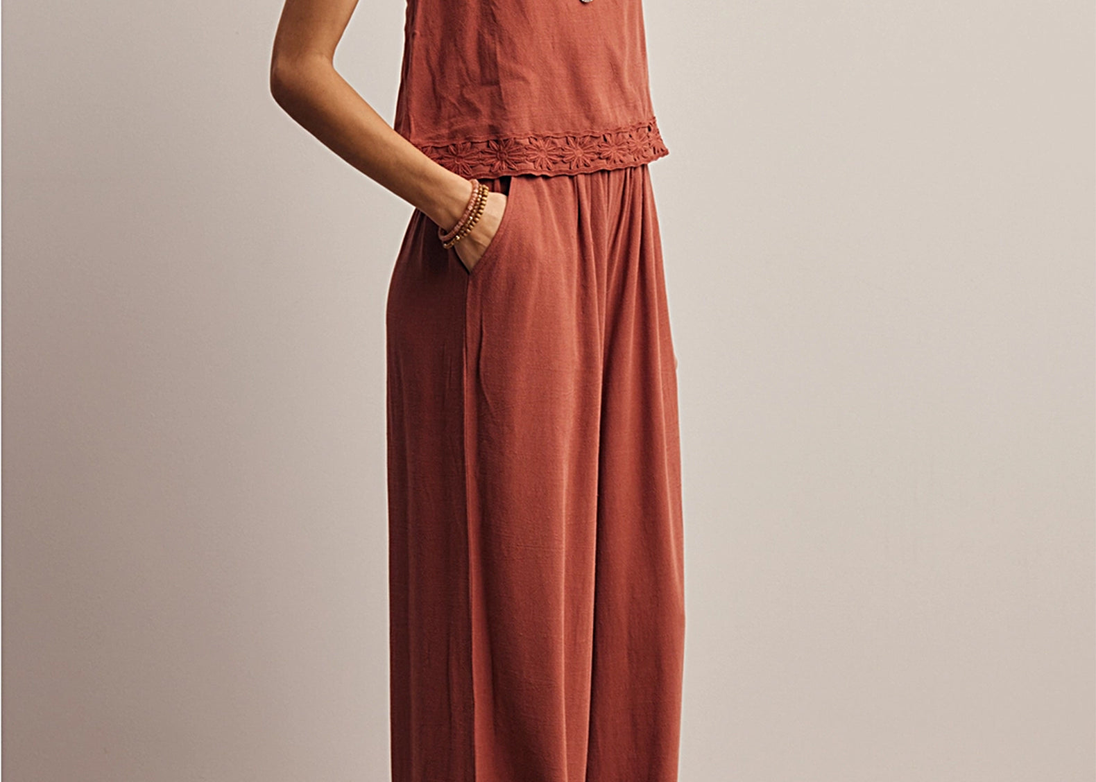 Side profile of the Layla Embroidered Masala Tank Top with floral embroidered straps, worn untucked with matching wide-leg pants