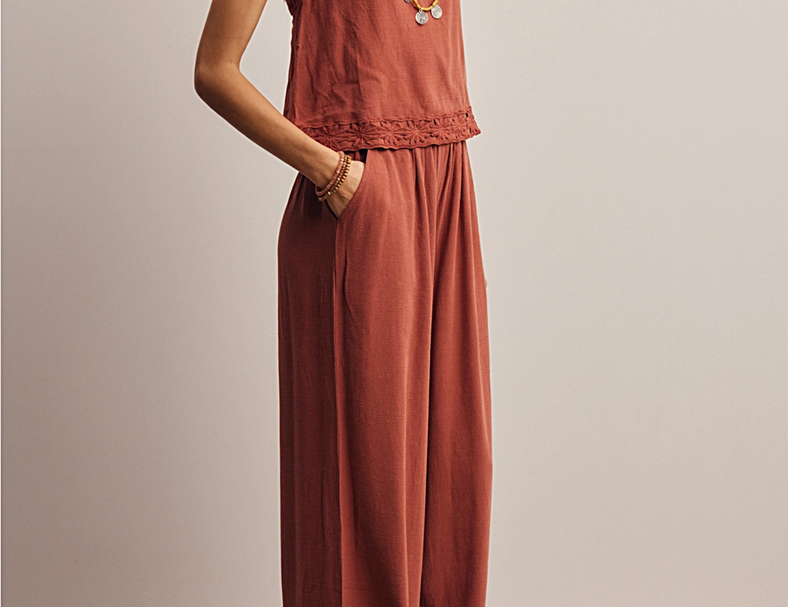 Side profile of the Layla Embroidered Masala Tank Top with floral embroidered straps, worn untucked with matching wide-leg pants