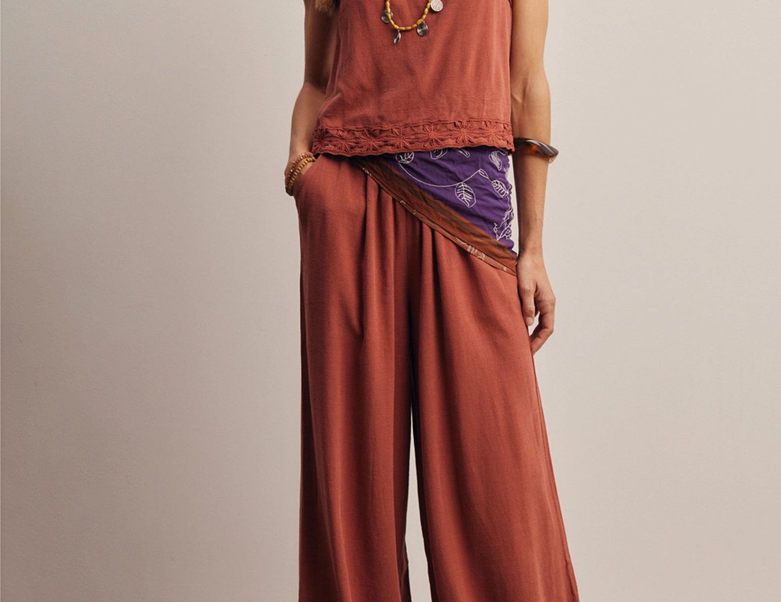 Front view of the Layla Embroidered Masala Tank Top, a boxy red-brown linen-blend tank with a square neckline and daisy trim
