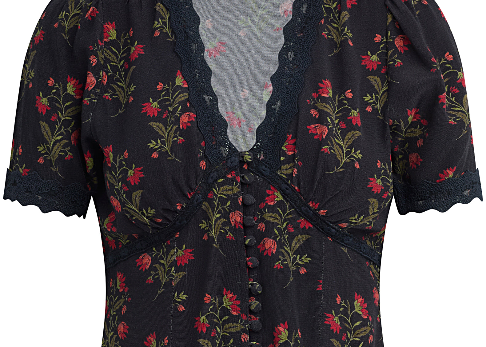 A short-sleeve floral blouse by Kari Traa, featuring a black base with red and green floral patterns, a lace-trimmed V-neckline, and a button-down front.