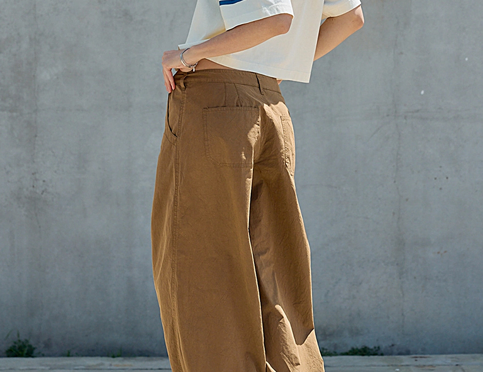 Full-length back view of the cropped varsity tee looking over the shoulder