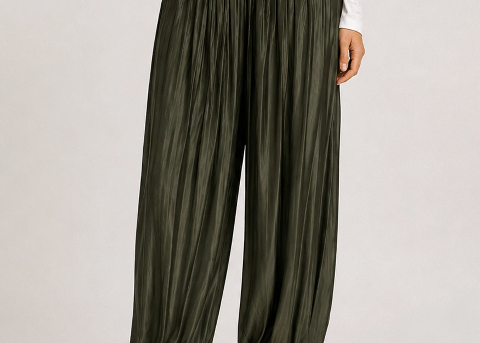 Front close-up of the Ricki evergreen crinkled satin balloon pants with elastic ankles 