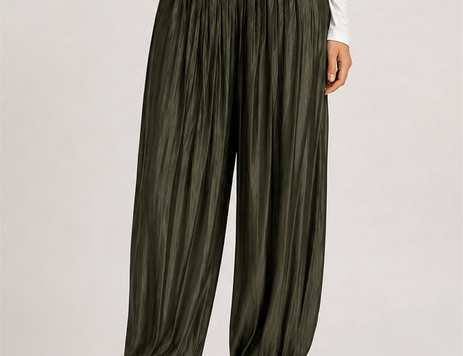 Front close-up of the Ricki evergreen crinkled satin balloon pants with elastic ankles 