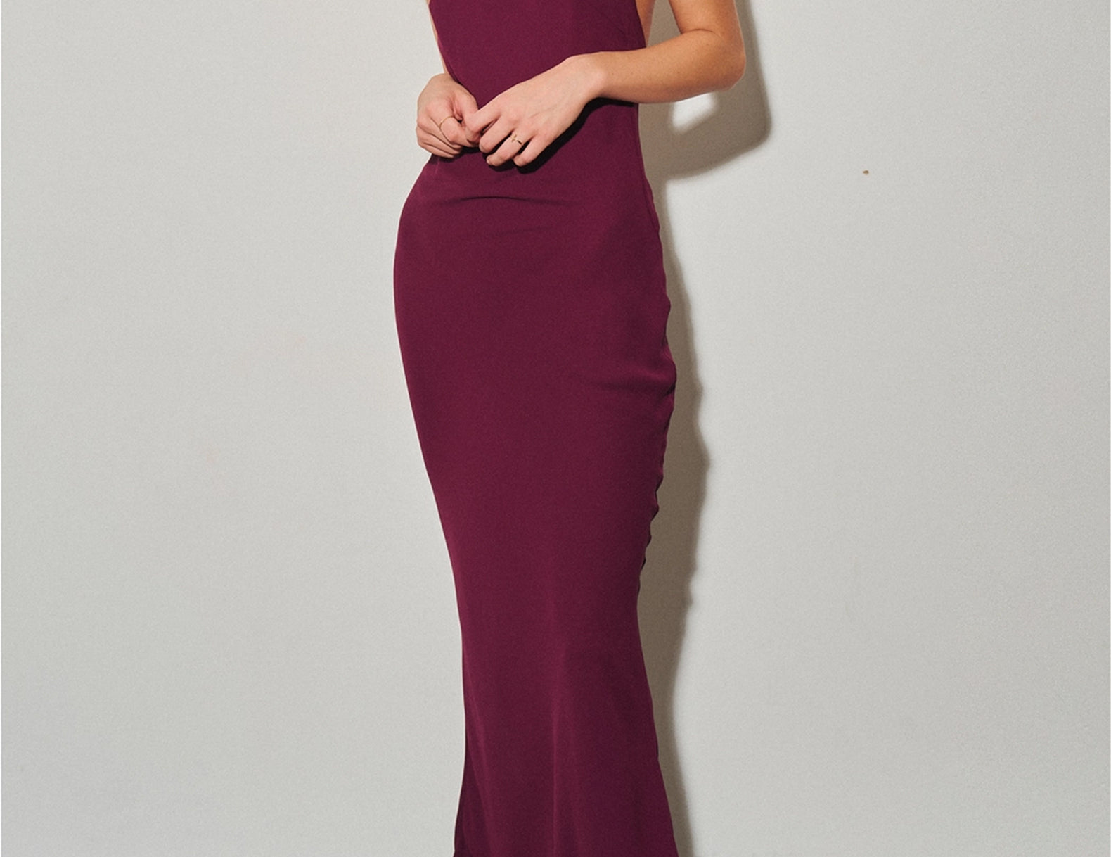 Front three-quarter view of the Simone chianti red chiffon halter maxi dress