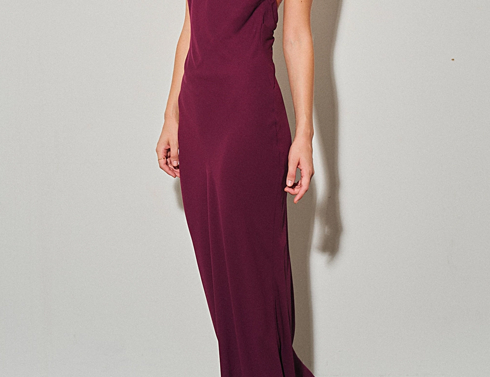 Side view of the chianti chiffon maxi dress with a high halter neck